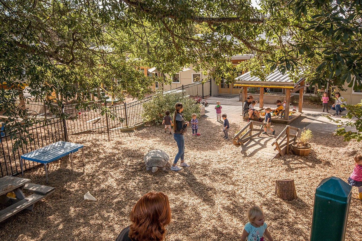Photo of children and adult attendants at Moss Street Childrens Center