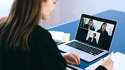 Photo of a woman at a laptop