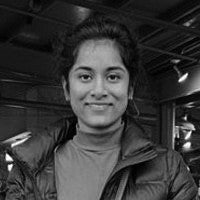 Photograph of Pavitra in black and white. 