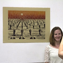 people look at artwork at the 2015 Spring Storm exhibit