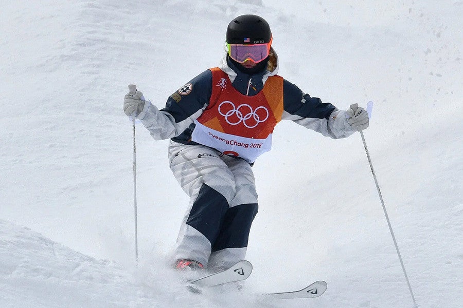 Shutterstock photo of a United States skier coming down the slopes in Italy. 