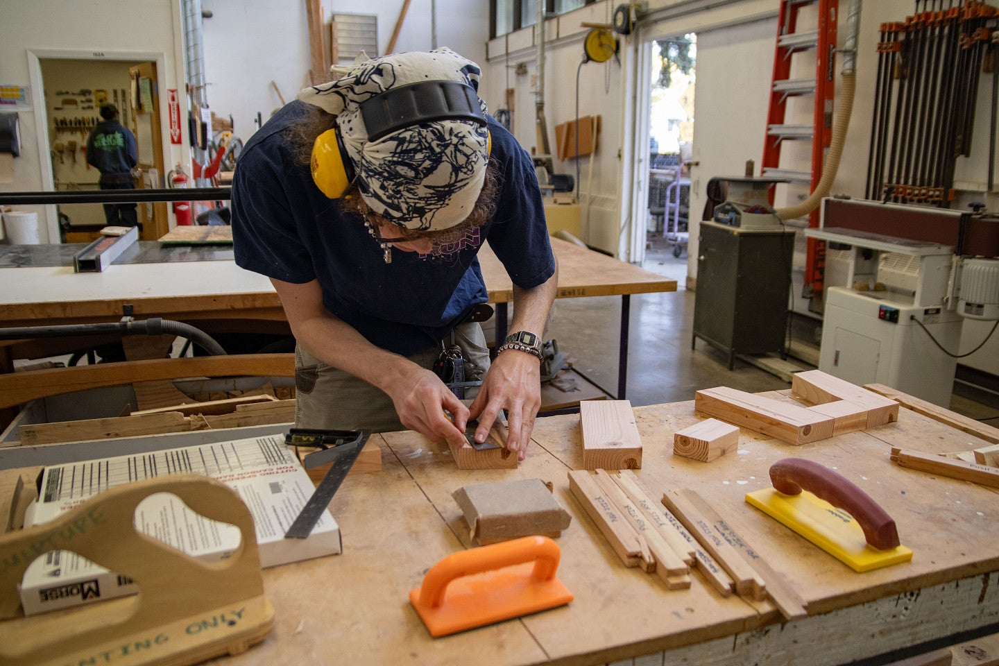Student uses specialty tools in Sculpture studio. Decorative. 