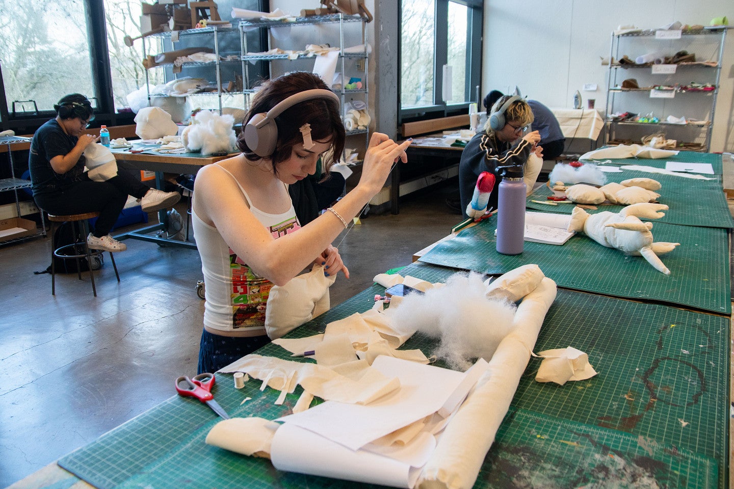 Students work on sewing projects in core studio. Decorative. 