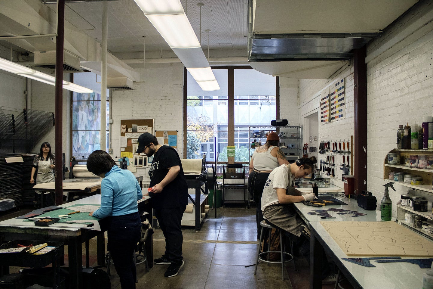 Students work in studio. Decorative.