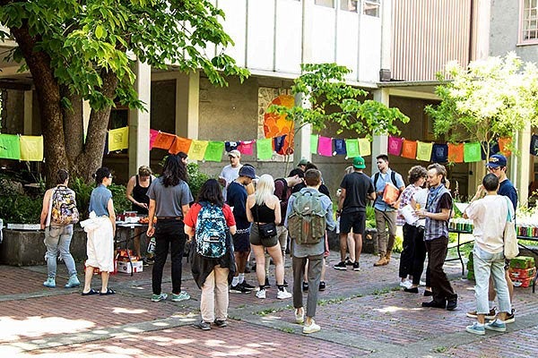 Students, faculty, and staff gathered for the annual Spring Storm opening reception in the Lawrence Hall courtyard.