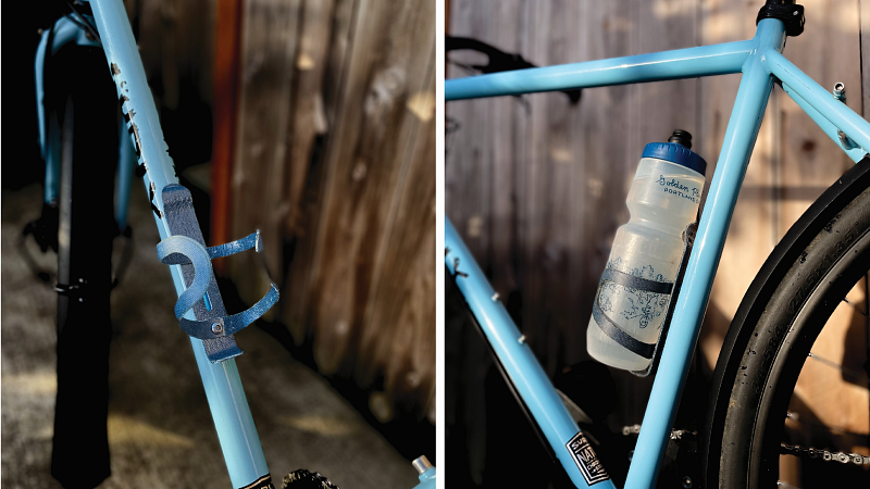 a blue bike with a water bottle holder made of upcycled denim, structured with resin.