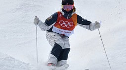 Shutterstock photo of a United States skier coming down the slopes in Italy. 