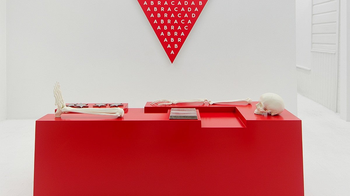 red desk and pennant artwork by Donald Morgan