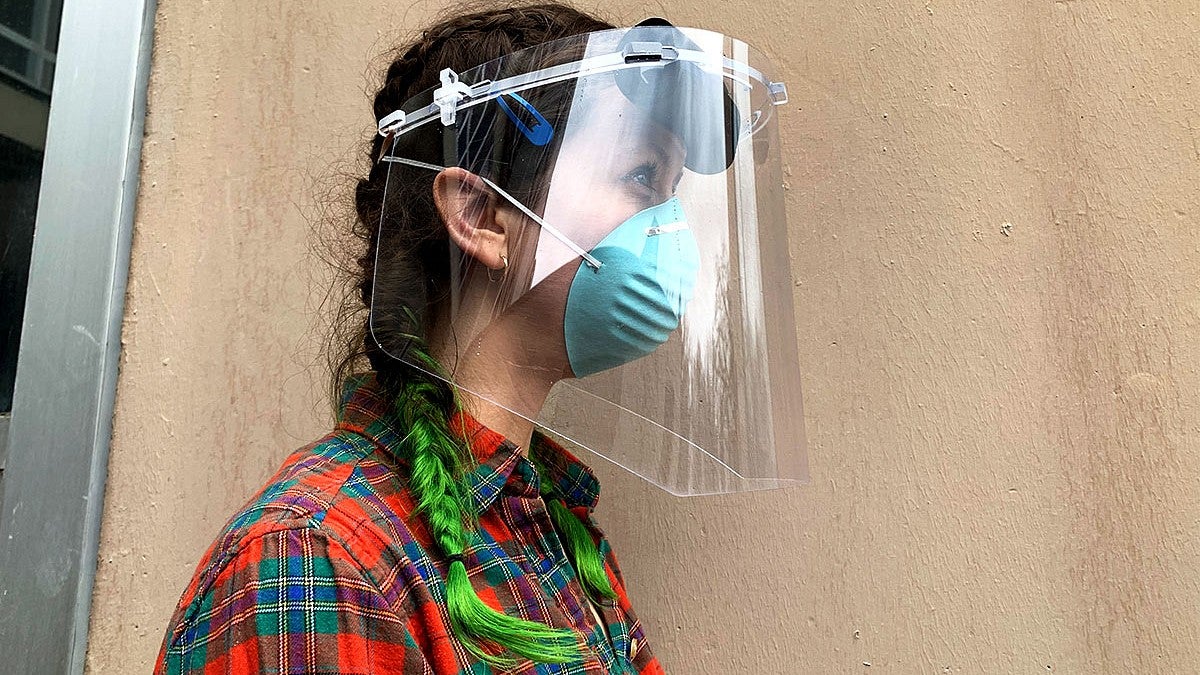 Student Geordi Helmick wearing a face shield