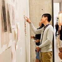 people look at artwork at the 2016 Spring Storm exhibit