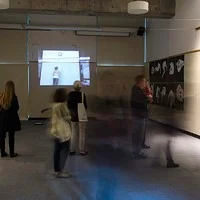 people look at artwork at the 2016 Spring Storm exhibit