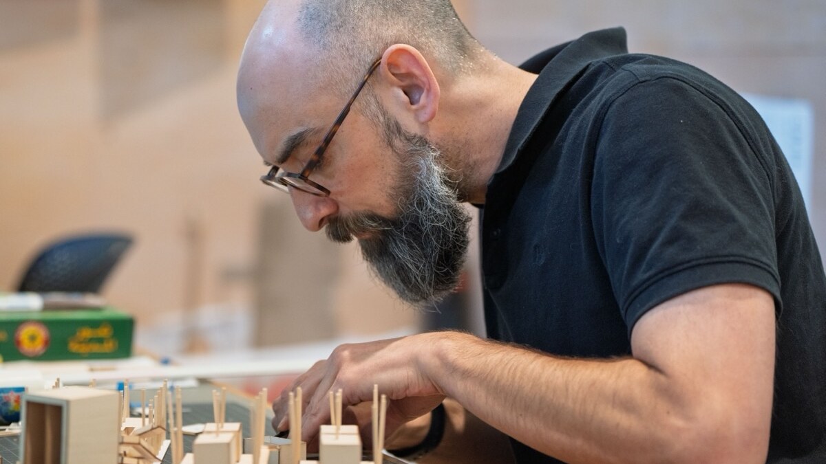A researcher builds a model in a Portland lab.