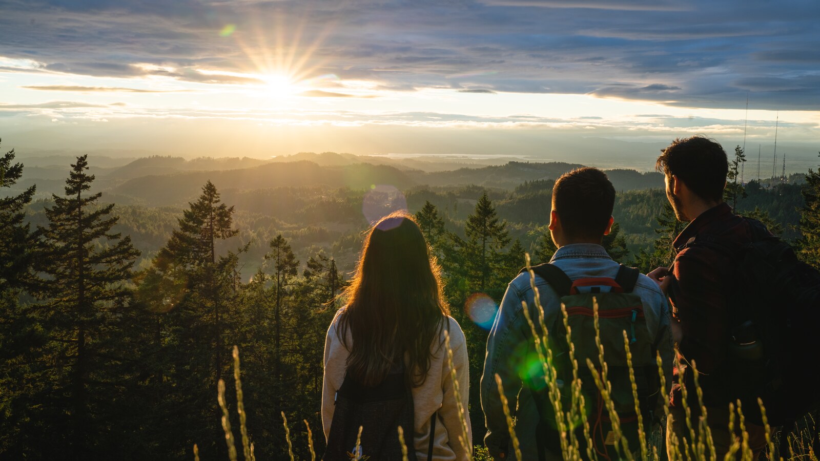 Students watch the sunrise from Spencer Butte.