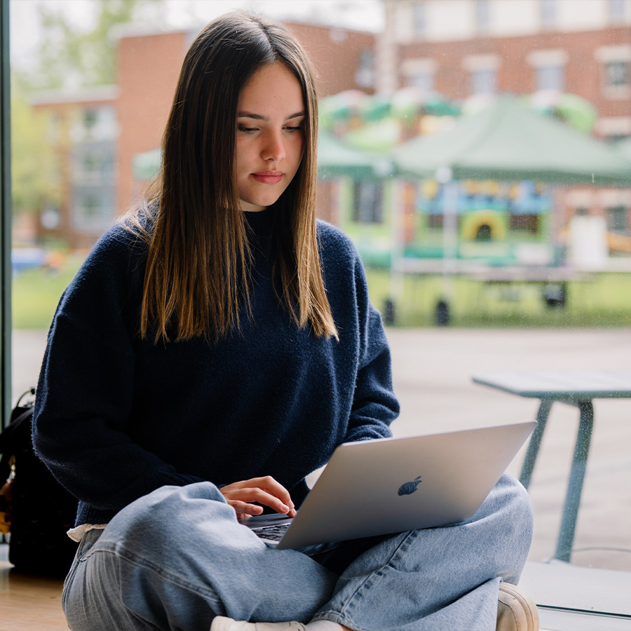 Female student studying on laptop