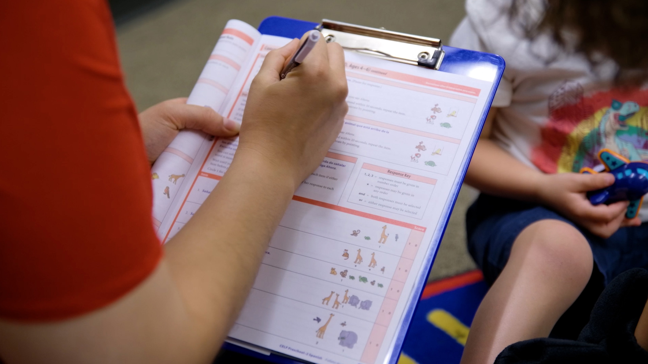 A clinician evaluates a classroom