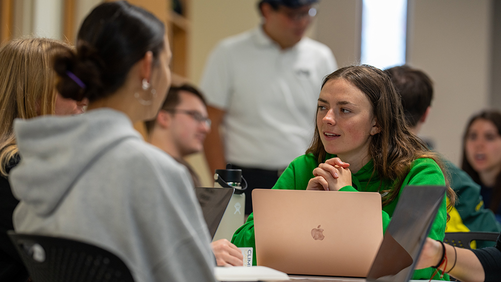Students talking around a table