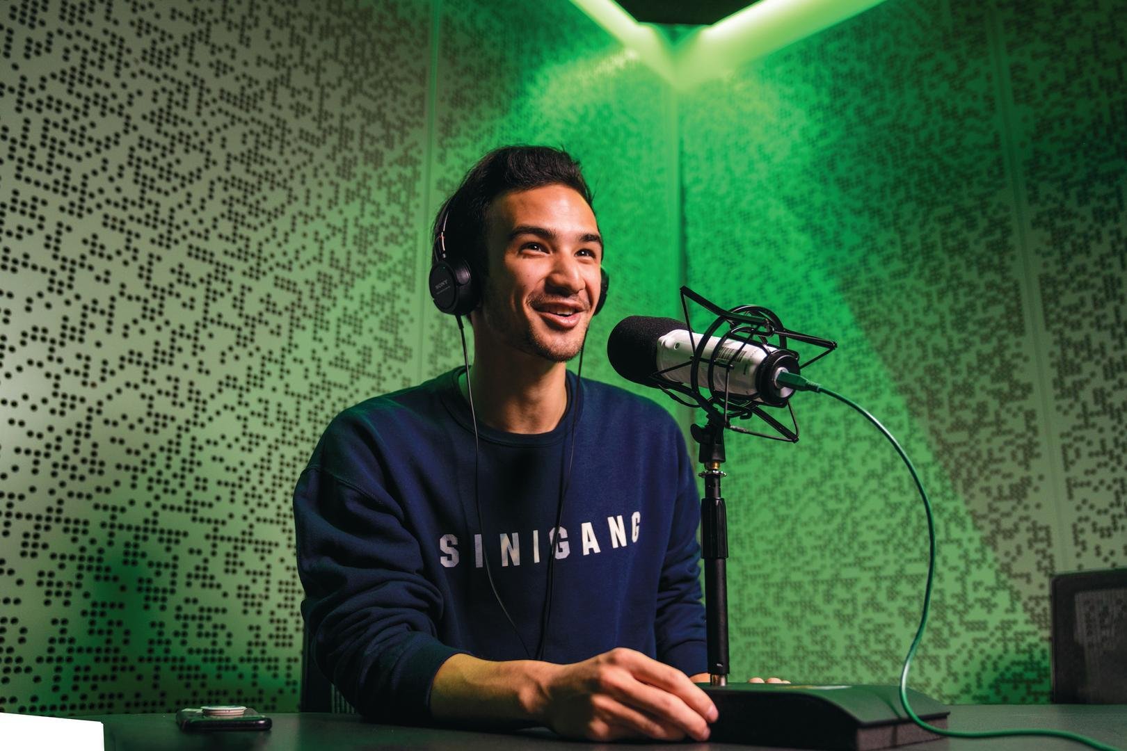 Student speaking into a microphone