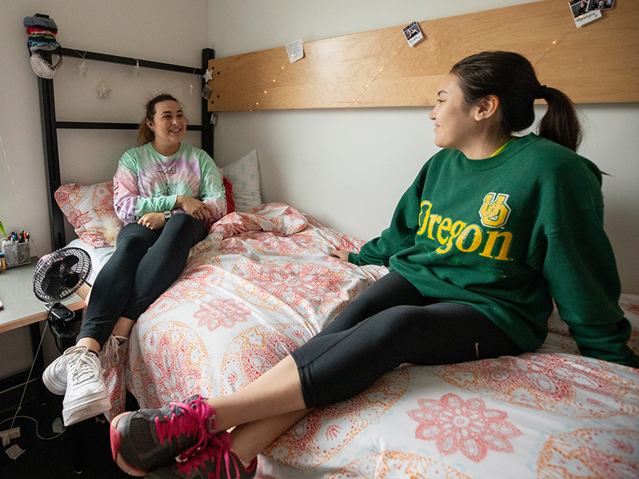 two students talking in their dorm