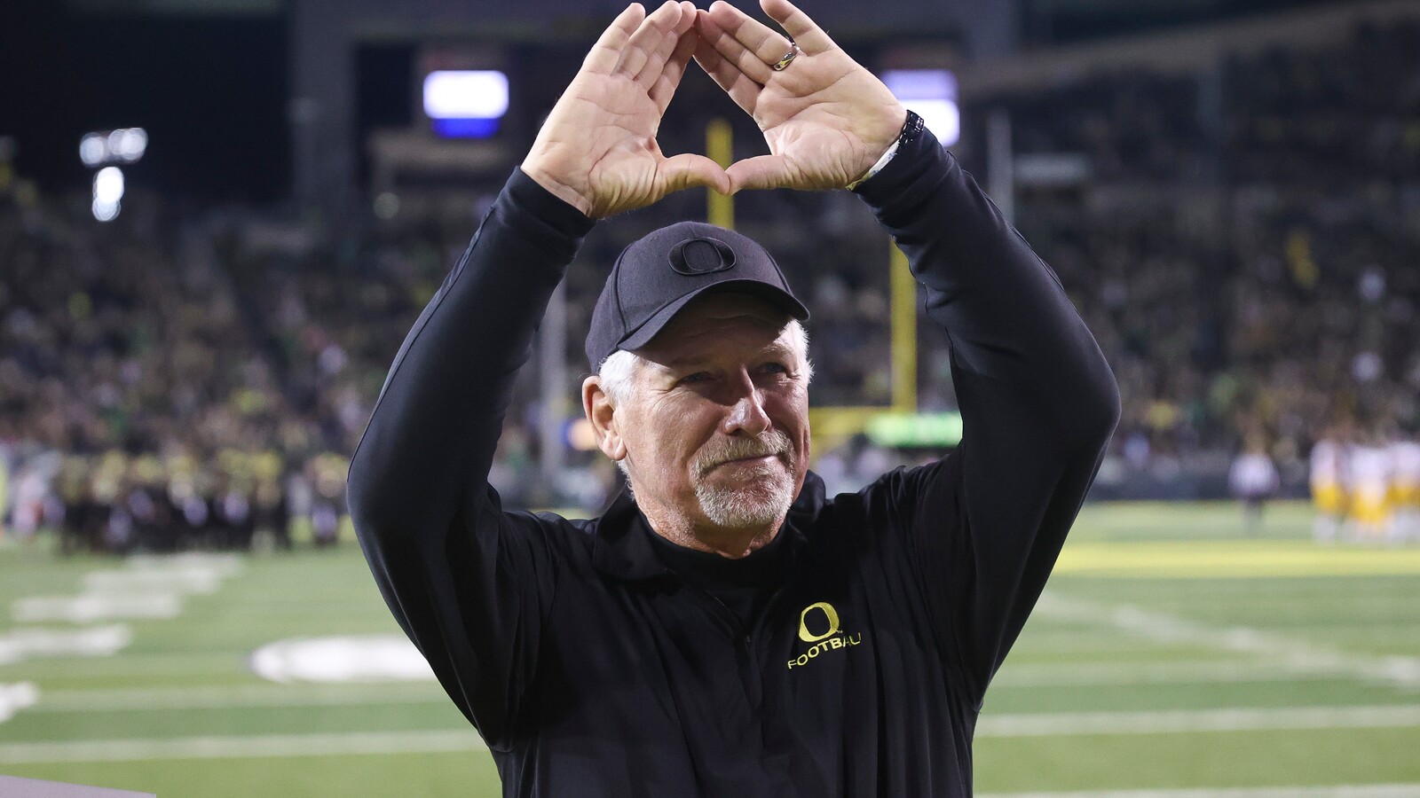 Mike Bellotti makes the Oregon O at Autzen Stadium.