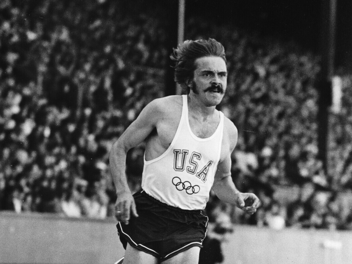 Steve Prefontaine runs in a USA uniform during a track meet.