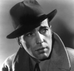 A man wearing a coat and hat