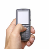 A hand holding a cell phone