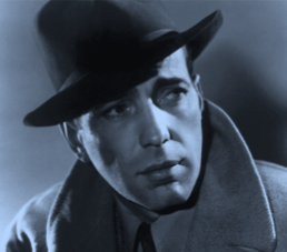 A man wearing a coat and hat