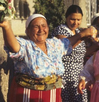 A woman dancing in the streets with others