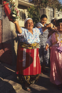 A woman dancing in the streets with others