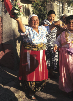 A woman dancing in the streets with others