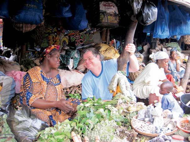 A man with natives at a market