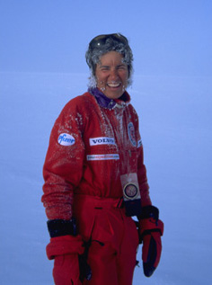A woman wearing a snow suit in the snow