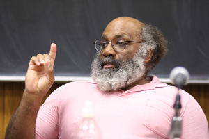 A man speaking at a table