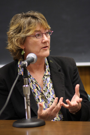 A woman speaking into a microphone