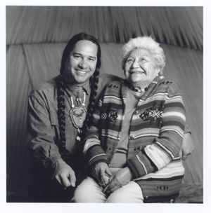 Two people sit on a couch