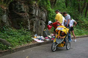 A group of people stand near a memorial site