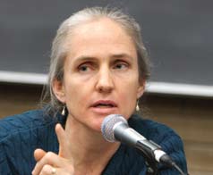 A woman speaking into a microphone