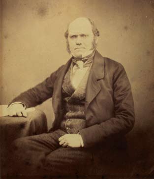 A portrait of man wearing a suit and vest