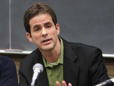 A man speaking into a microphone