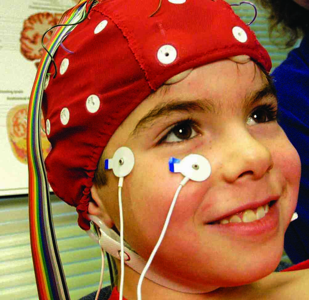 A subject wearing a brain cap in a laboratory