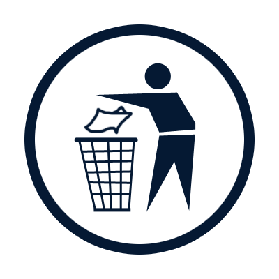 A person throwing trash into a wastebasket