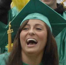 A graduate wearing a cap with a tassle