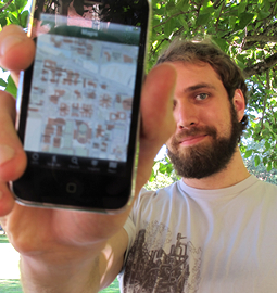 A man shows his iPhone app