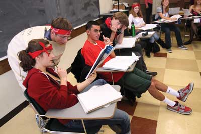 Students work out problems in a classroom