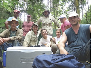A professor and his students in a forest