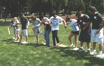 High school students playing a game in a field