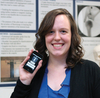 A young woman holding an iPod touch