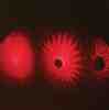 Red laser lights on a black background