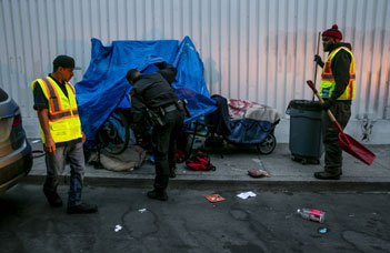 homeless person on sidewalk