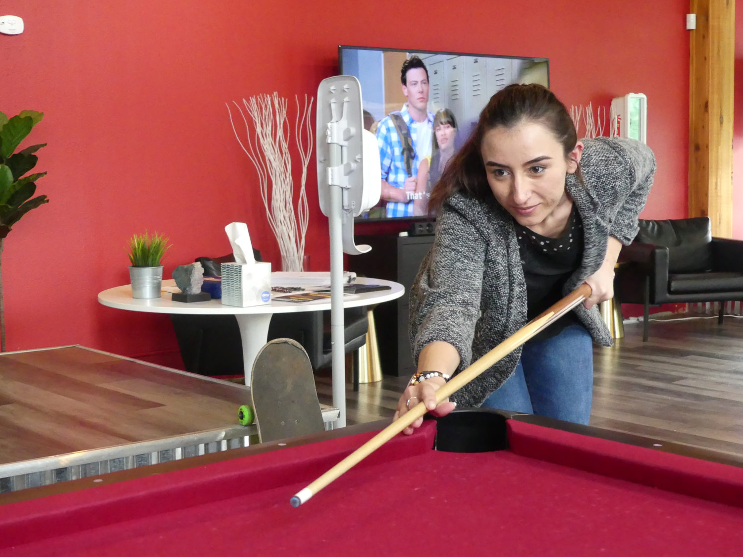 woman playing pool